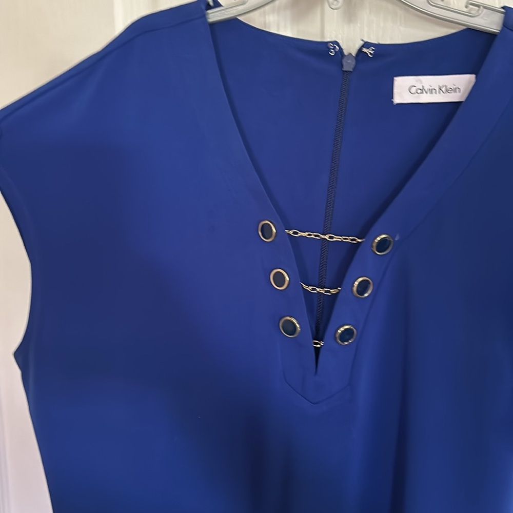 Calvin Klein women’s size large dress with button and chain. Scarf included.